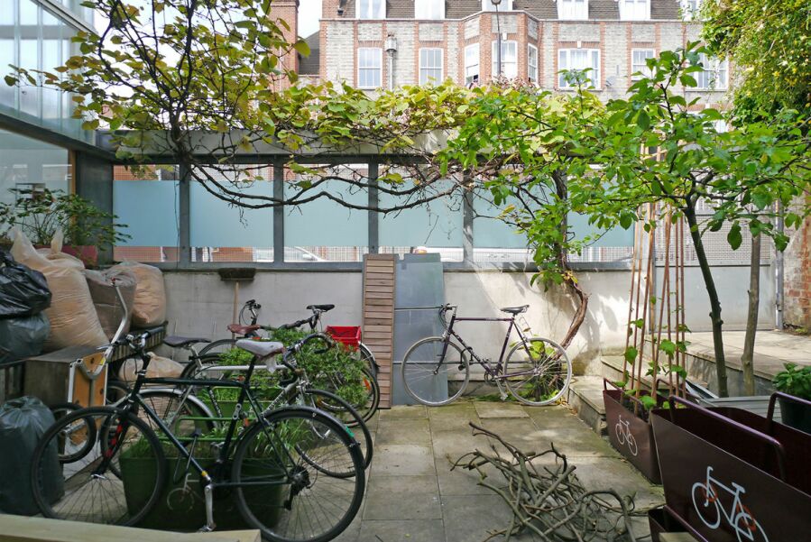 bicycles in a garden courtyard.